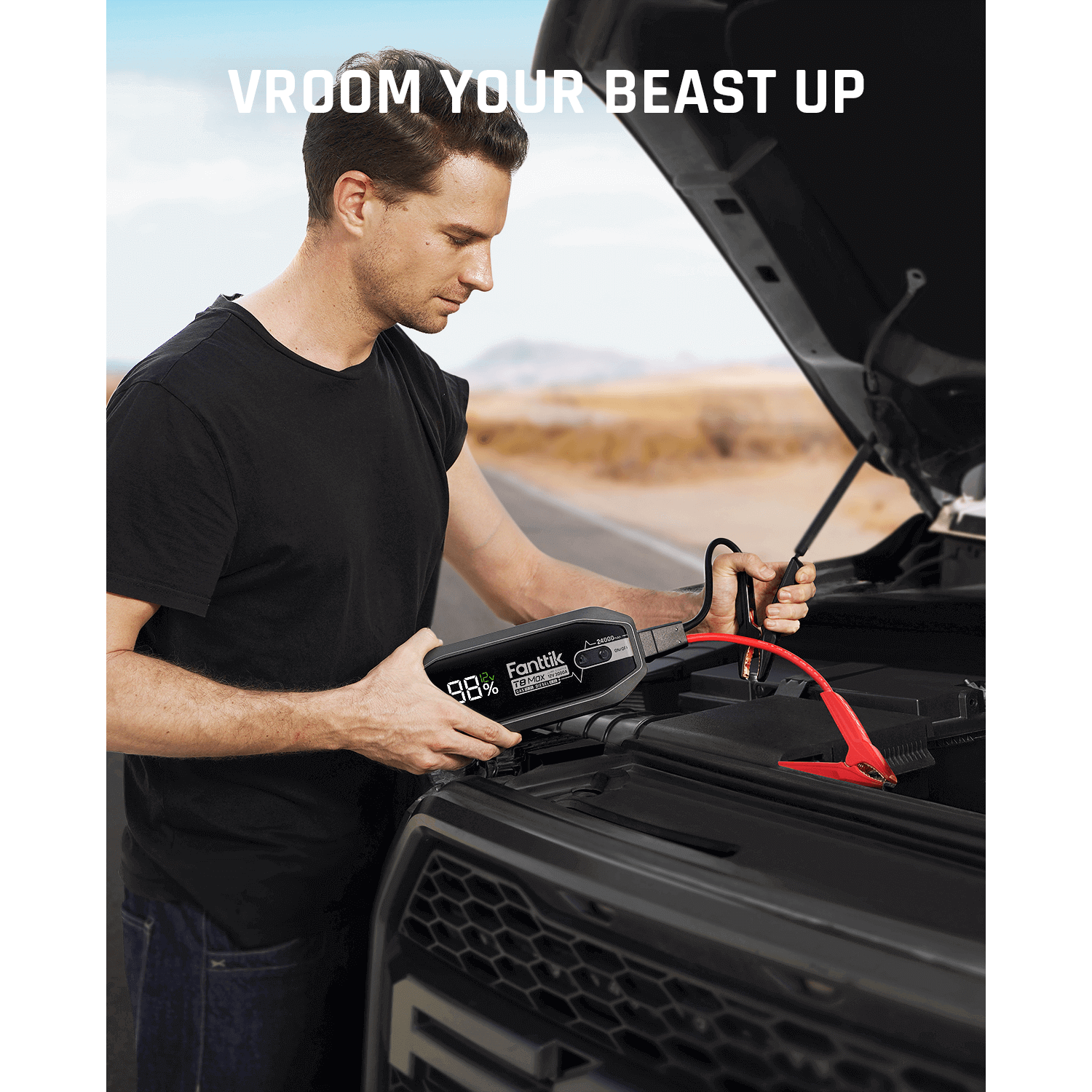 Man using Fanttik T8 MAX 4000 Amp jump starter with 98% battery on car engine