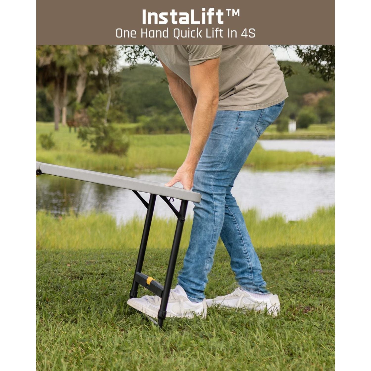 Man demonstrating one-hand height adjustment on a white FanttikOutdoor Zeta X6 Pro 6ft folding table outdoors.