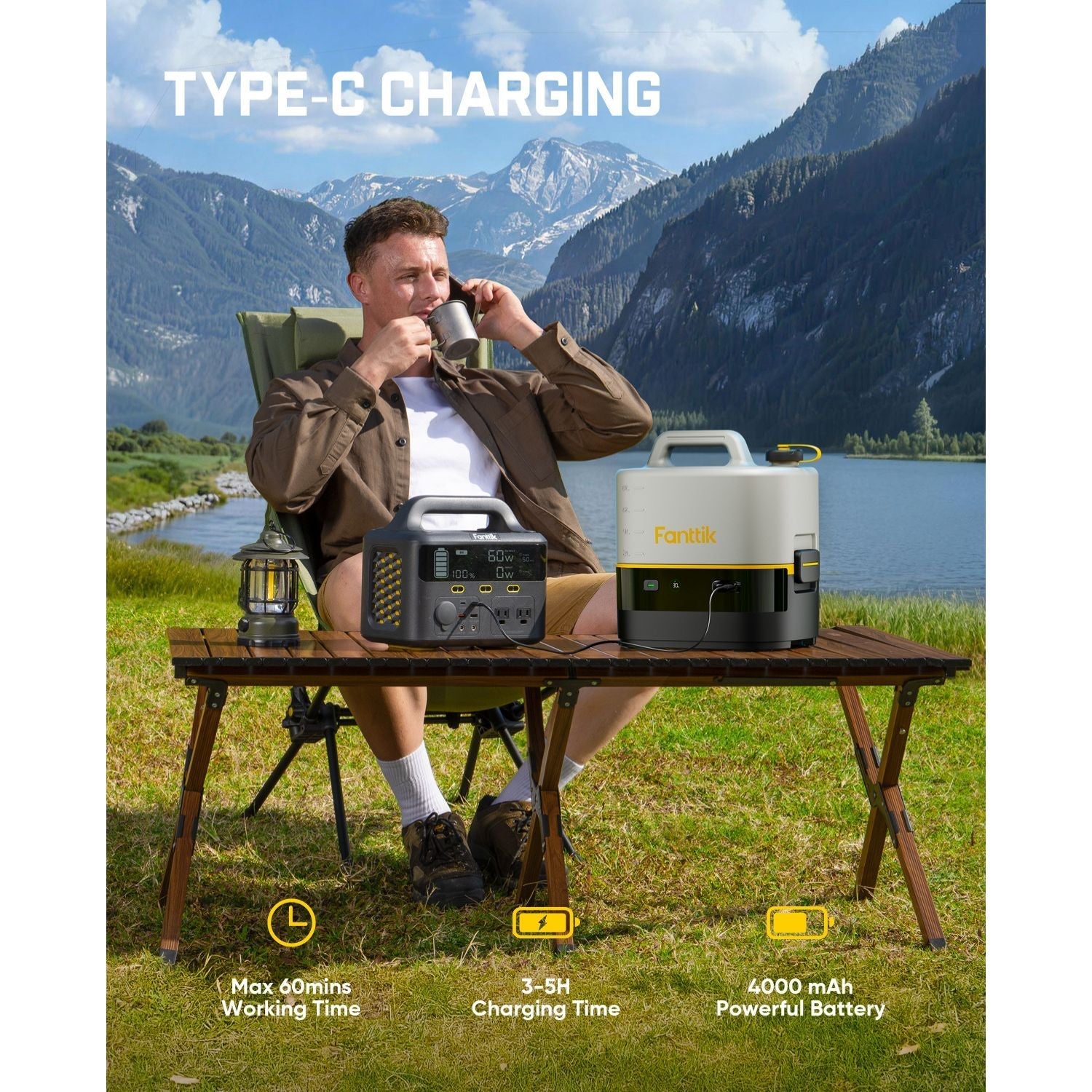 Person sitting at a table with camping equipment NB10 Nano portable pressure washer and a scenic mountain backdrop