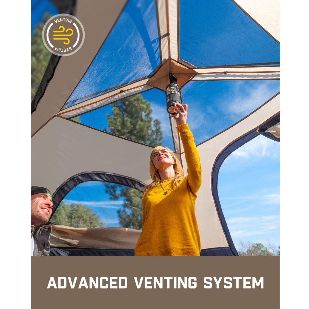 FanttikOutdoor Zeta C4 Pro tent interior with woman holding a lantern, highlighting the advanced venting system.