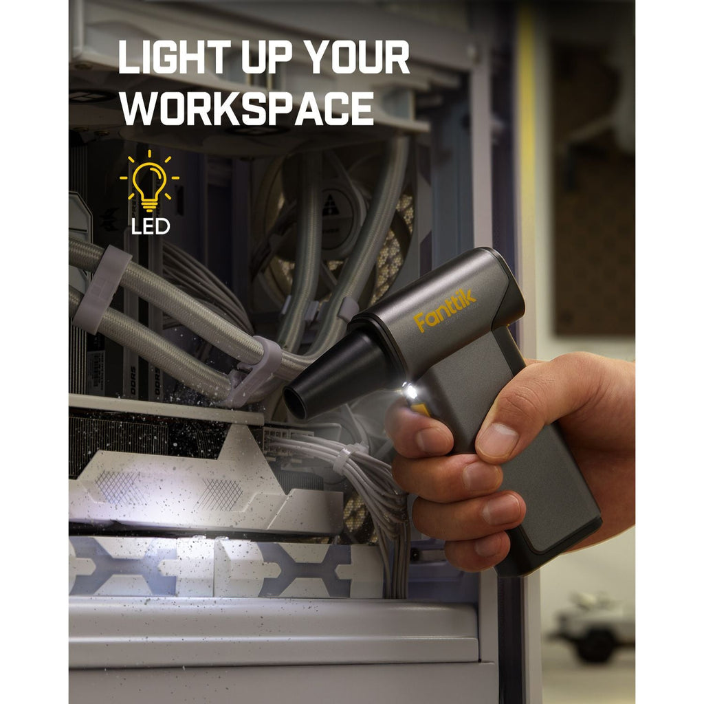Fanttik B10 Pro Max electric air duster with LED light cleaning dust inside a computer.