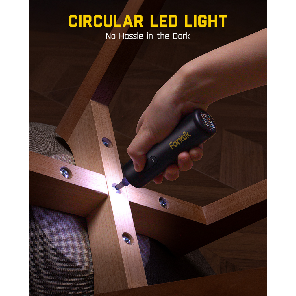 Fanttik S1 Capsule cordless screwdriver with circular LED light assisting in dark furniture assembly.