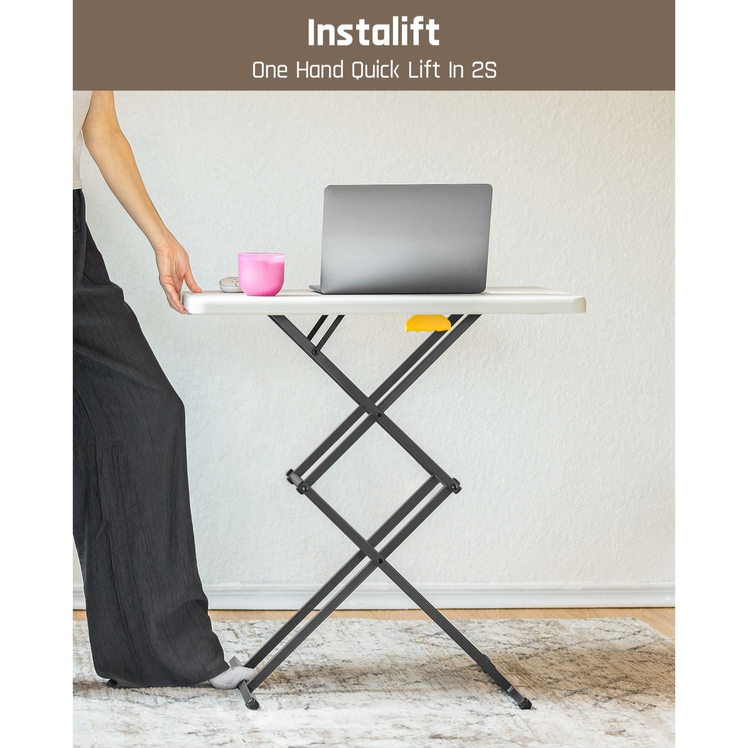 FanttikOutdoor Zeta X1 Apex folding table with laptop and pink mug, demonstrating quick height adjustment.