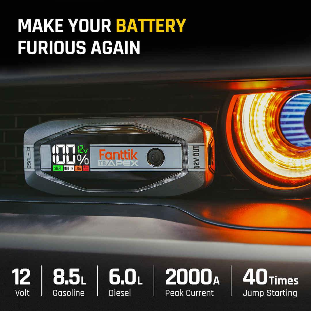 Fanttik T8 APEX 2000 Amp jump starter on car dash, showing 100% charge and 8.5L gasoline/6.0L diesel capability.