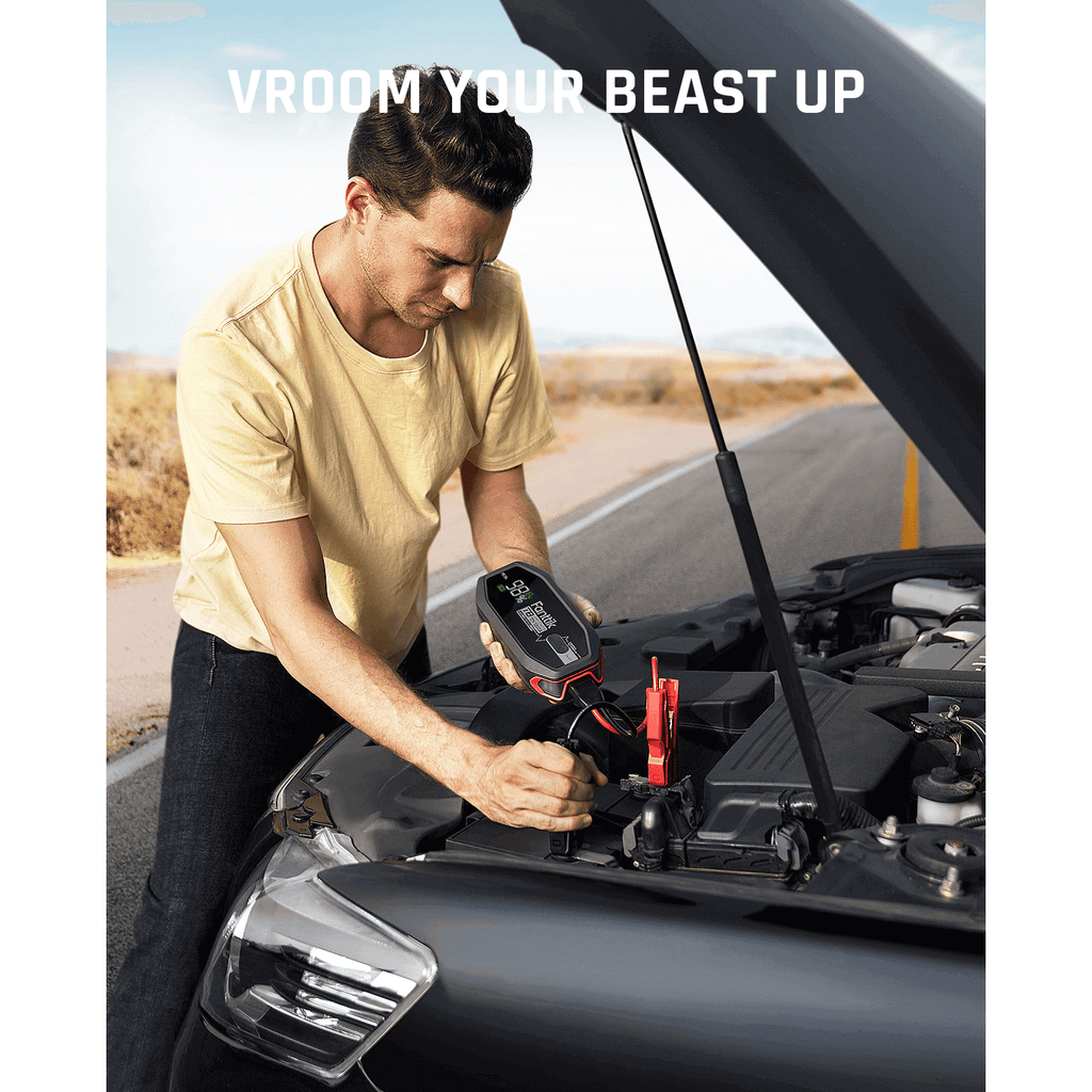 Fanttik T8 1300 amp jump starter connected to car battery roadside