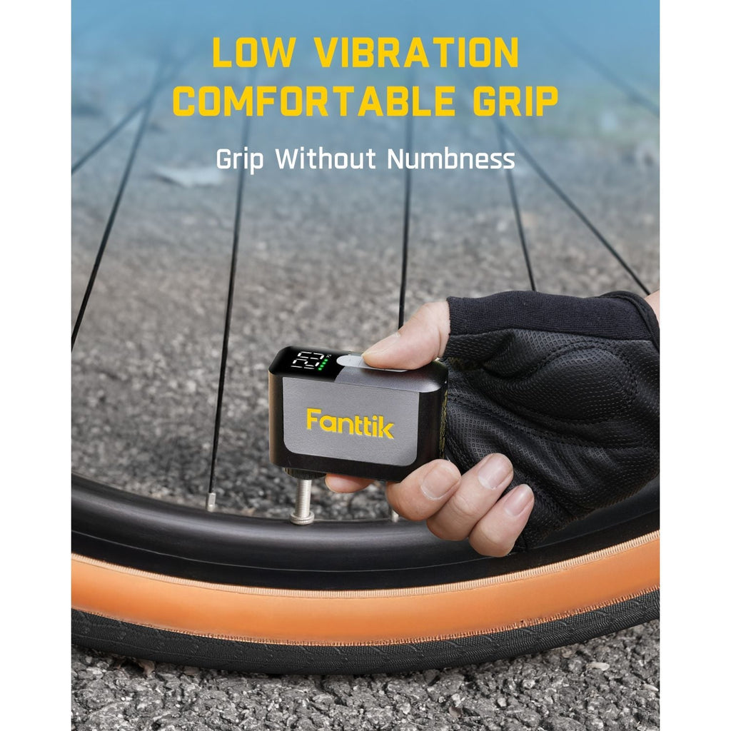 Fanttik X10 Ace mini bike pump with low vibration and comfortable grip, attached to a bicycle tire.