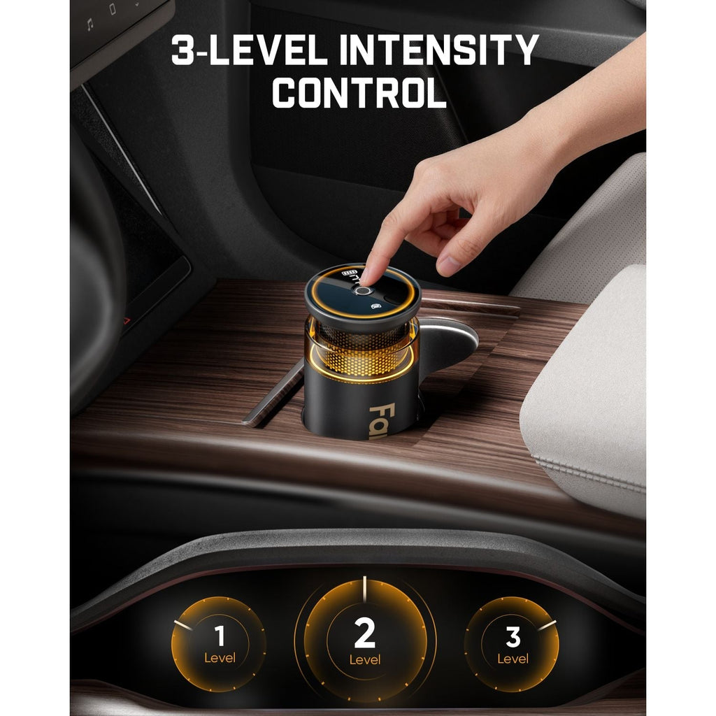 Fanttik N10 Smart Car Air Freshener with a device for 3-level intensity control, hand pressing a button.