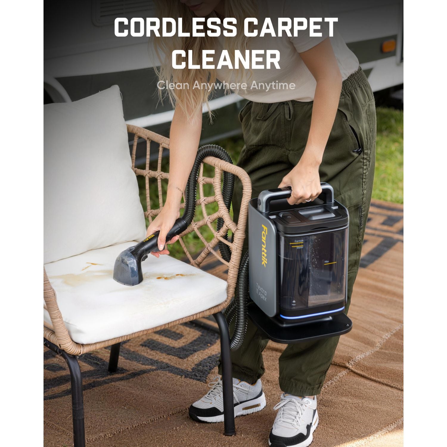 Person using a Fanttik Textra 11 Apex Cordless Carpet and Upholstery Cleaner on a chair outdoors.