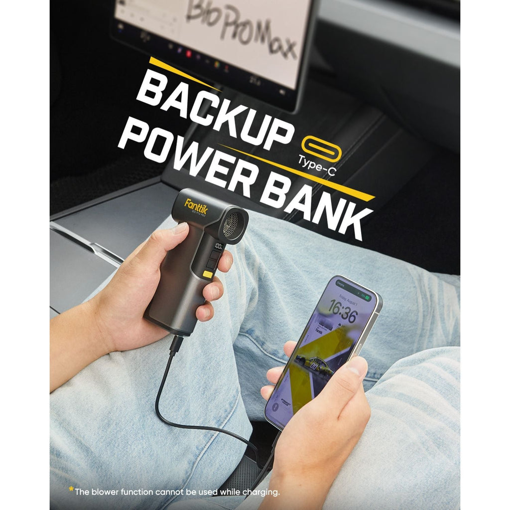Fanttik B10 Pro Max electric air duster charging a smartphone via Type-C, functioning as a backup power bank.