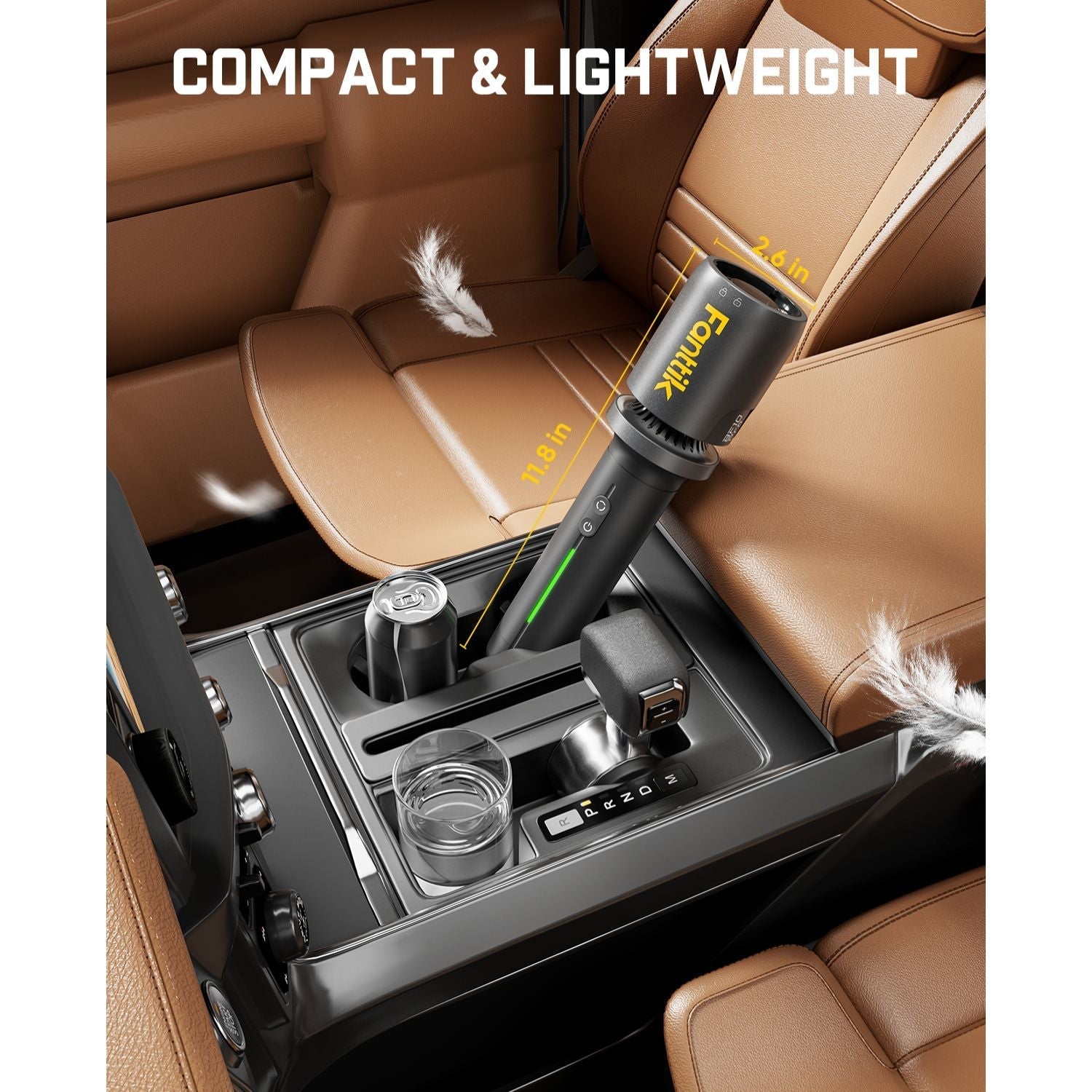 Fanttik BF10 Pro leaf blower is compact & lightweight, shown in a car. 2.6" W x 11.8" L. Fits car console easily.