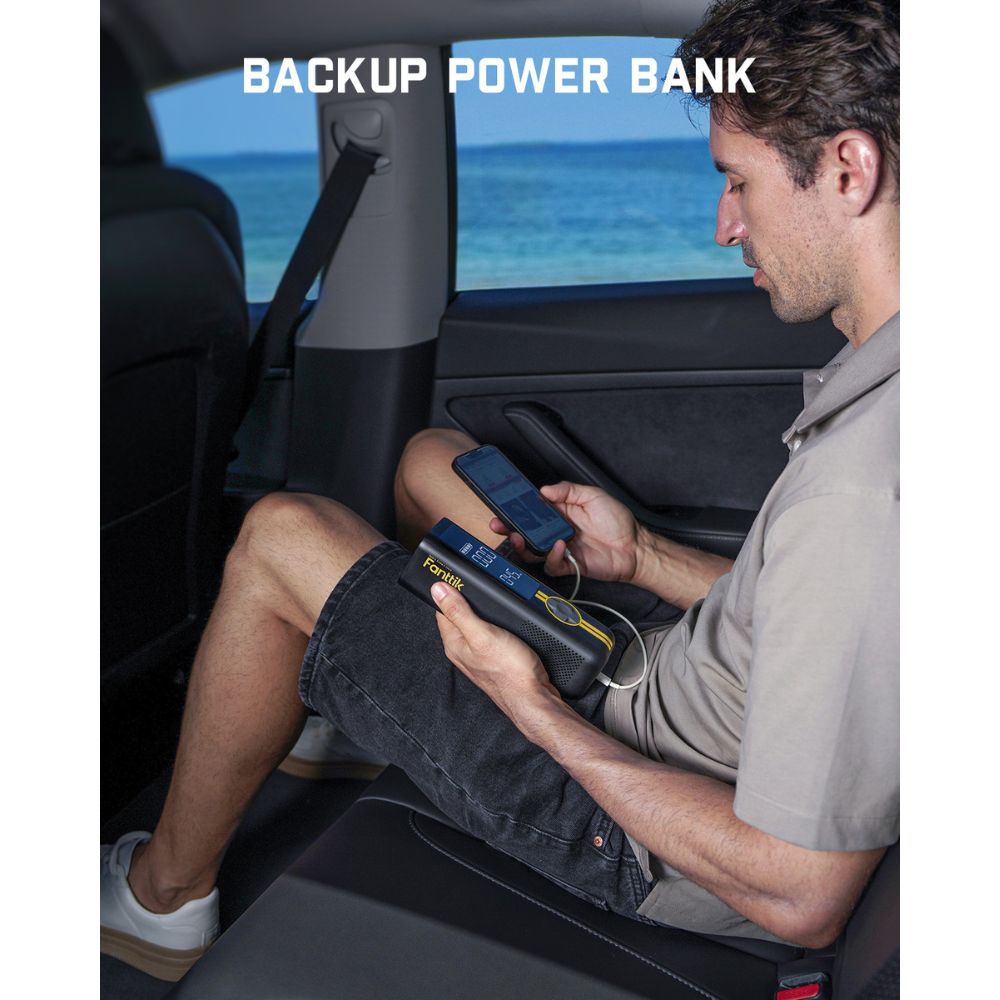 Fanttik portable backup power bank charging a phone in a car