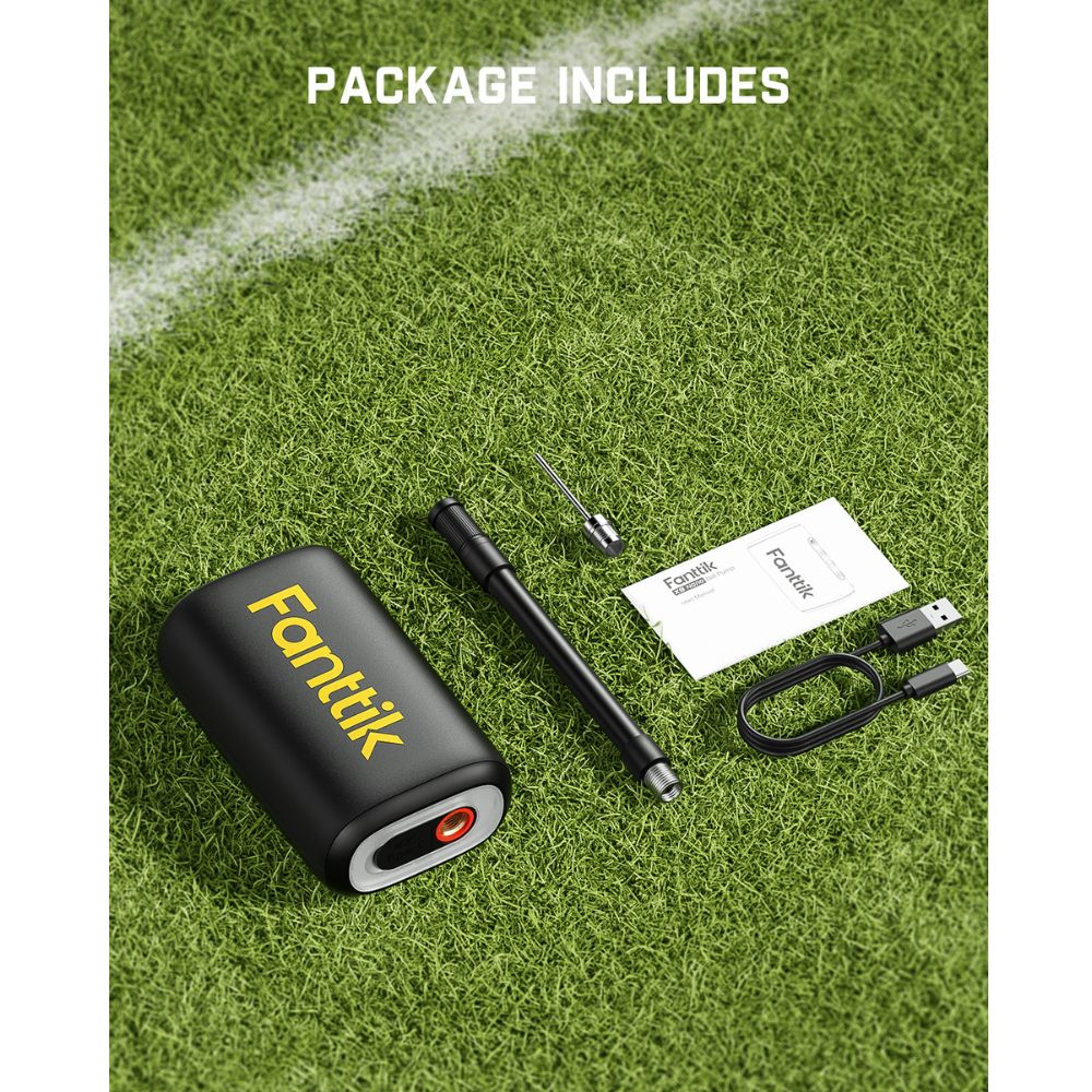 Fanttik X9 Nano electric ball pump package contents with inflation needle, USB-C cable, and manuals on grass.