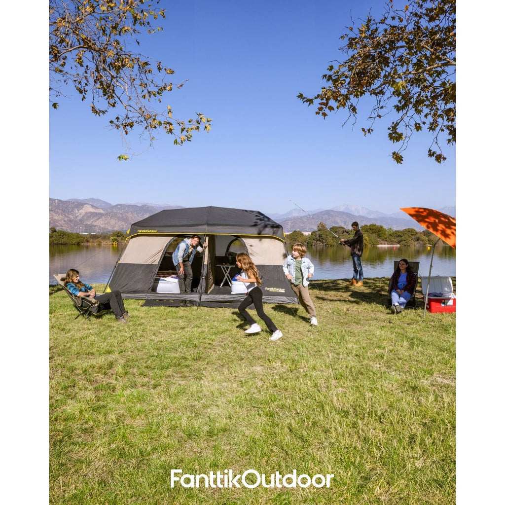 FanttikOutdoor Zeta C10 Pro Max 10 person camping tent set up by a lake with a family enjoying the outdoors.