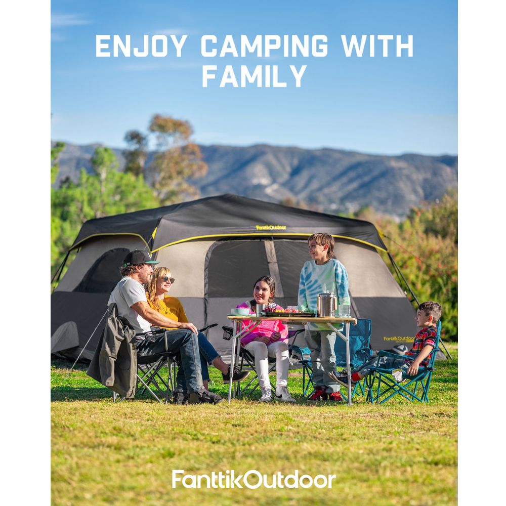 Family enjoying a picnic in front of a large FanttikOutdoor 10-person cabin tent.