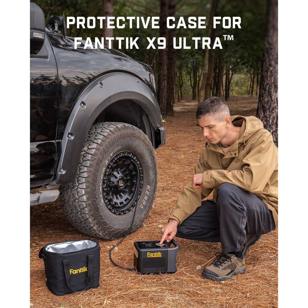 Black Fanttik carrying bag with silver lining, designed for the Fanttik X9 Ultra tire inflator, outdoors by a vehicle.